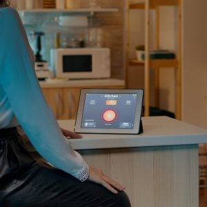 Tablet on kitchen counter displaying smart home control app